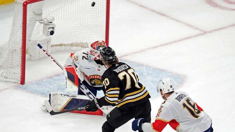 Boston Bruins' Jesper Boqvist (70) scores past Florida Panthers' Sergei Bobrovsky (72) ahead of Aleksander Barkov (16) during overtime in an NHL hockey game, Saturday, April 6, 2024, in Boston. (AP Photo/Michael Dwyer)