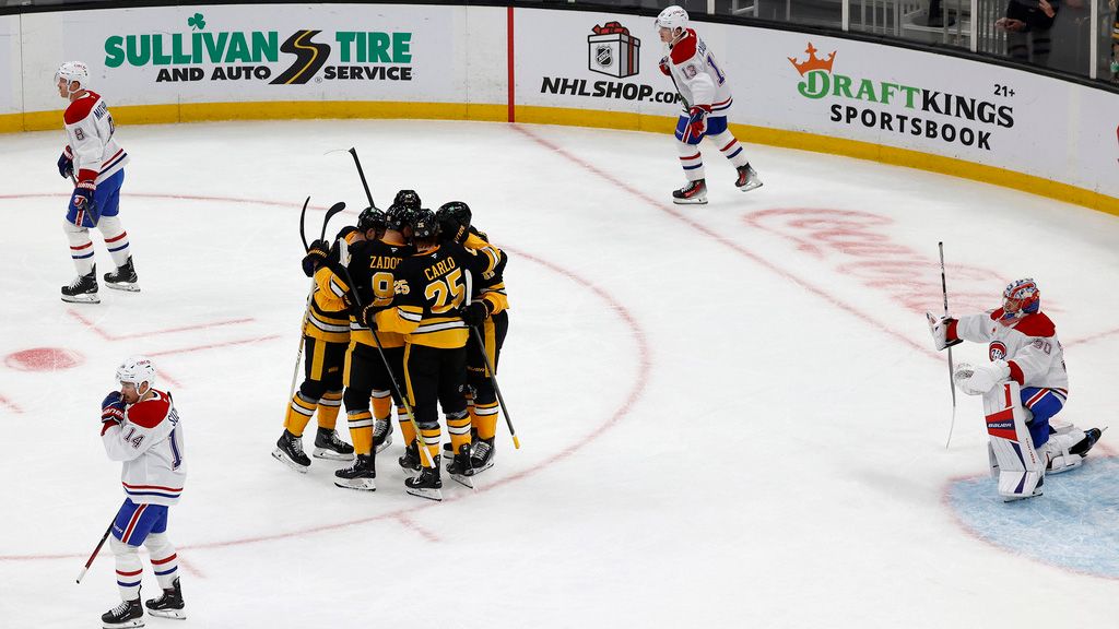 Boston Bruins players, center left, celebrate after a goal by Charlie Coyle as Montreal Canadiens players react during the first period of an NHL hockey game, Sunday, Dec. 1, 2024, in Boston. (AP Photo/Mary Schwalm)