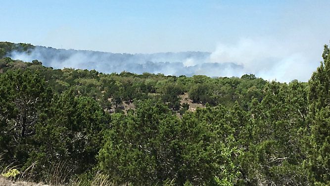 Smoke from a brush fire is visible in Lago Vista, Texas, in this image from April 11, 2018. (Jeff Strensland/Spectrum News)