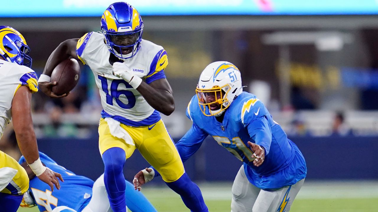 Los Angeles Rams quarterback Bryce Perkins (16) runs against the Los Angeles Chargers during the first half of a preseason NFL football game Saturday, Aug. 13, 2022, in Inglewood, Calif. (AP Photo/Ashley Landis)