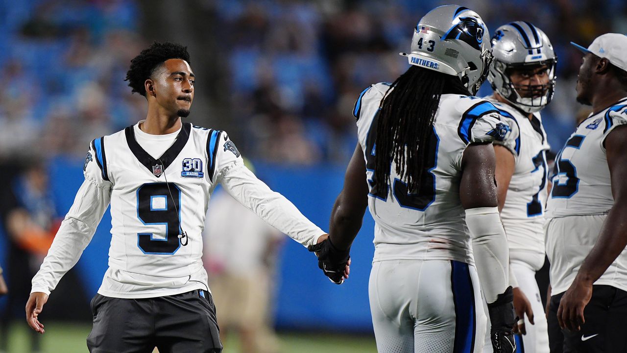 Carolina Panthers quarterback Bryce Young (9) greets teammates during the second half of a preseason NFL football game against the New York Jets, Saturday, Aug. 17, 2024, in Charlotte, N.C. (AP Photo/Jacob Kupferman)