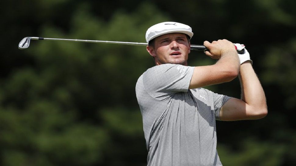 Bryson DeChambeau tees off on the third hole during the final round of the Dell Technologies Championship golf tournament at TPC Boston in Norton, Mass., Monday, Sept. 3, 2018. (AP Photo/Michael Dwyer)