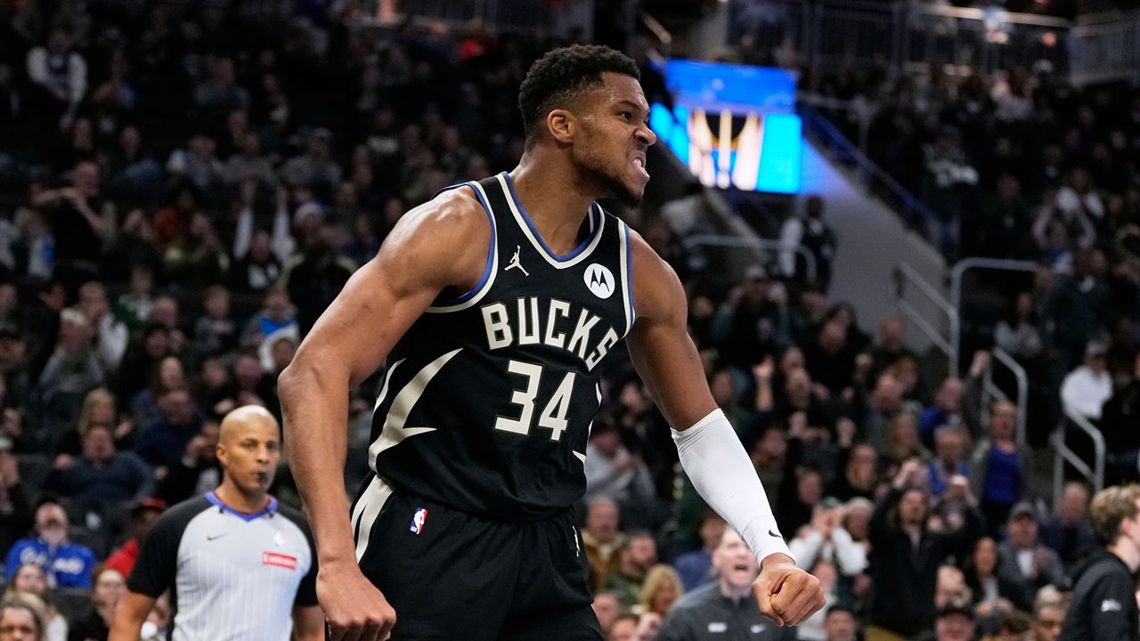 Milwaukee Bucks' Giannis Antetokounmpo reacts after a dunk during the second half of an Emirates NBA cup tournament quarterfinals basketball game against the Orlando Magic Tuesday, Dec. 10, 2024, in Milwaukee. (AP Photo/Morry Gash)