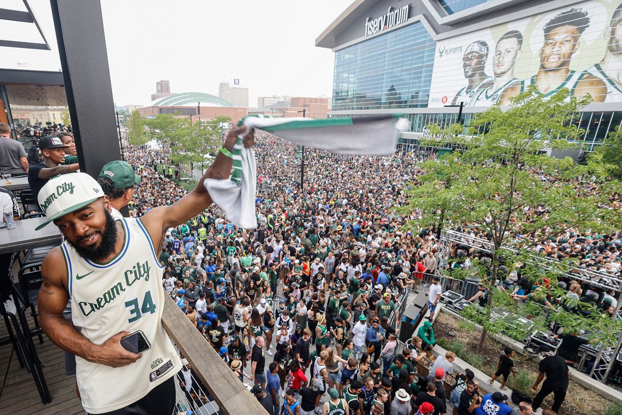 FILE - In this July 20, 2021, file photo, Milwaukee Bucks forward Giannis  Antetokounmpo holds the NBA Championship trophy, left, and Most Valuable  Player trophy after defeating the Phoenix Suns in Game