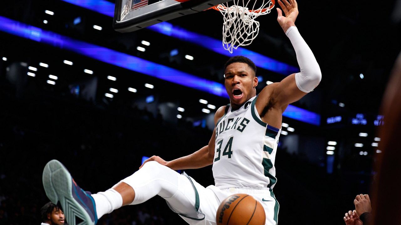 Milwaukee Bucks forward Giannis Antetokounmpo (34) reacts after a dunk against the Brooklyn Nets during the second half of an NBA basketball game, Monday, Nov. 6, 2023, in New York. 