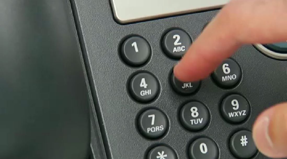 A person dials a phone in this undated file image. (Spectrum News/FILE)