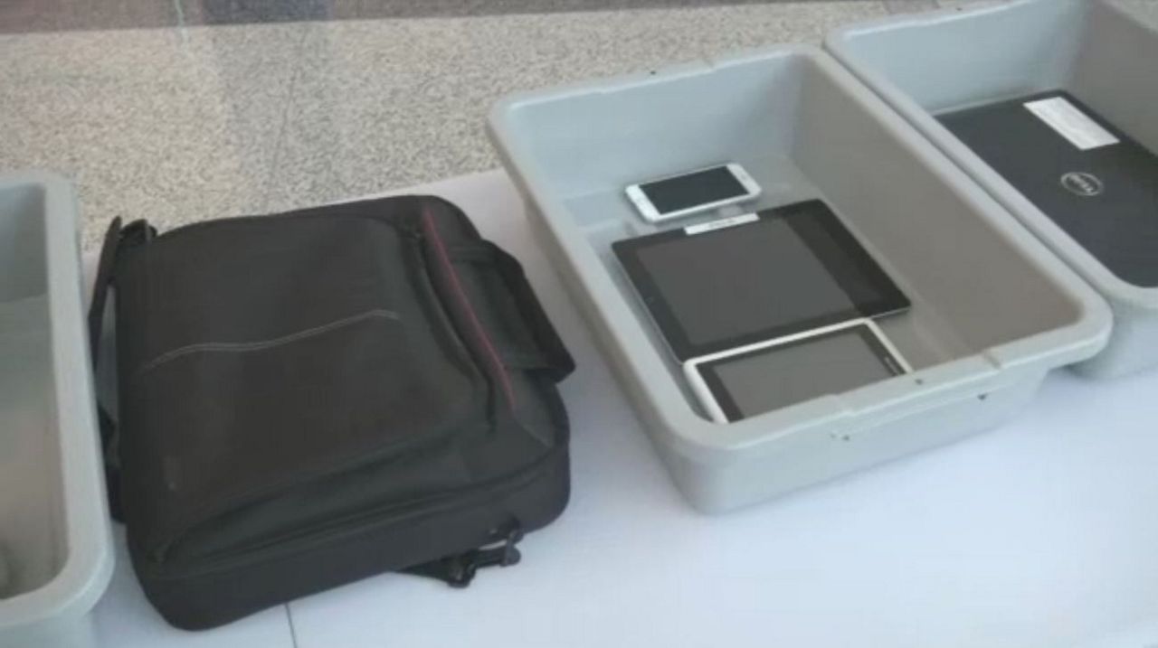 New TSA procedures taking electronics out of bags and into bins