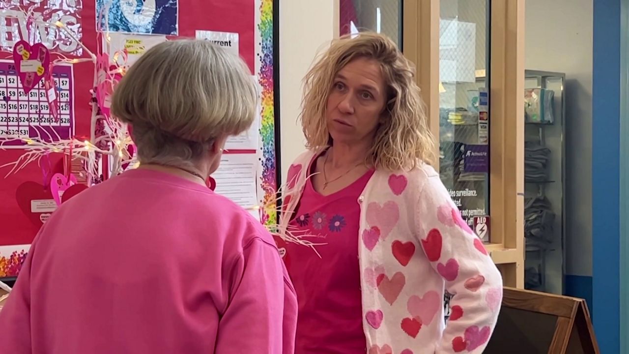 Buffy Clark, right, volunteers with Gifts from the Heart in Avery County. (Spectrum News 1/Rose Eiklor)