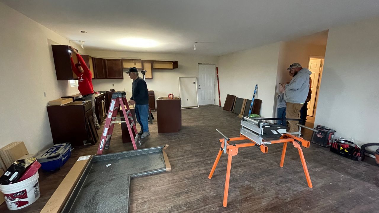 Volunteers from a handful of states work to finish this home (Spectrum News 1/Mason Brighton)