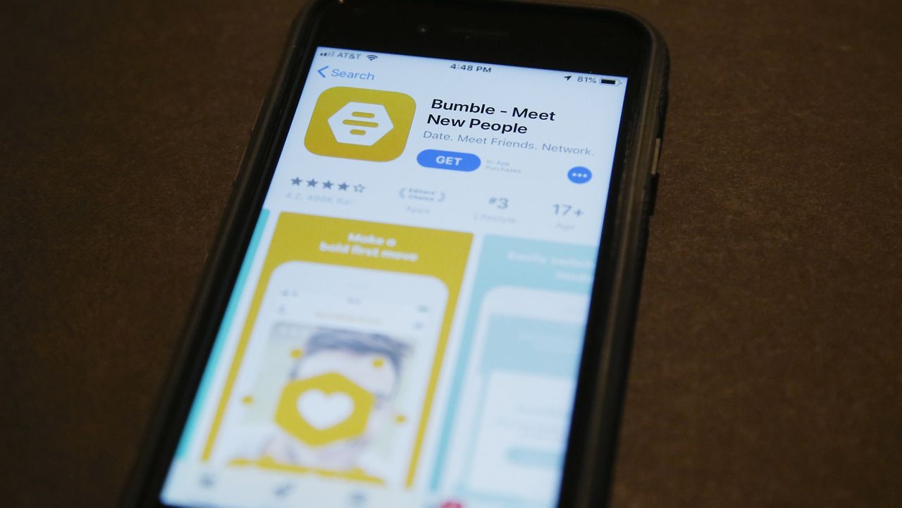 A phone with an App Store selection of the dating app Bumble is pictured Thursday, Aug. 29, 2019, in Oklahoma City. (AP Photo/Sue Ogrocki)