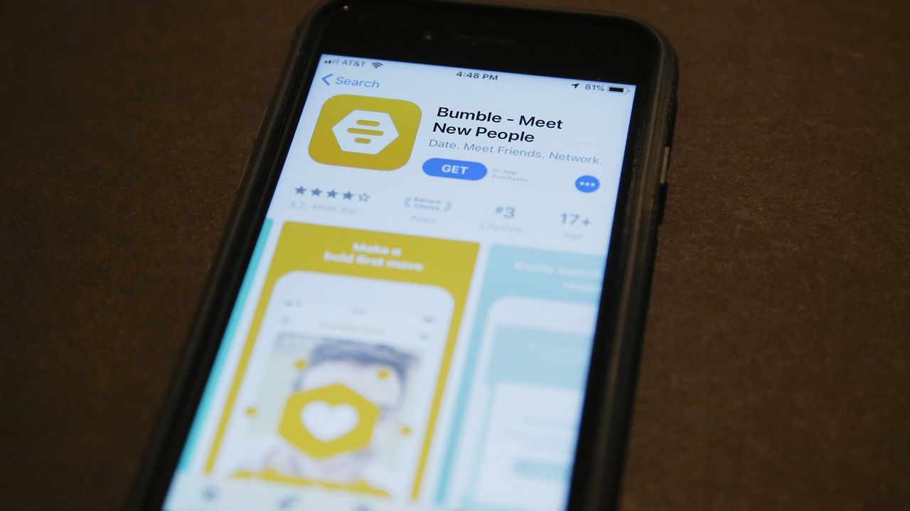 A phone with an App Store selection of the dating app Bumble is pictured Thursday, Aug. 29, 2019, in Oklahoma City. (AP Photo/Sue Ogrocki, File)