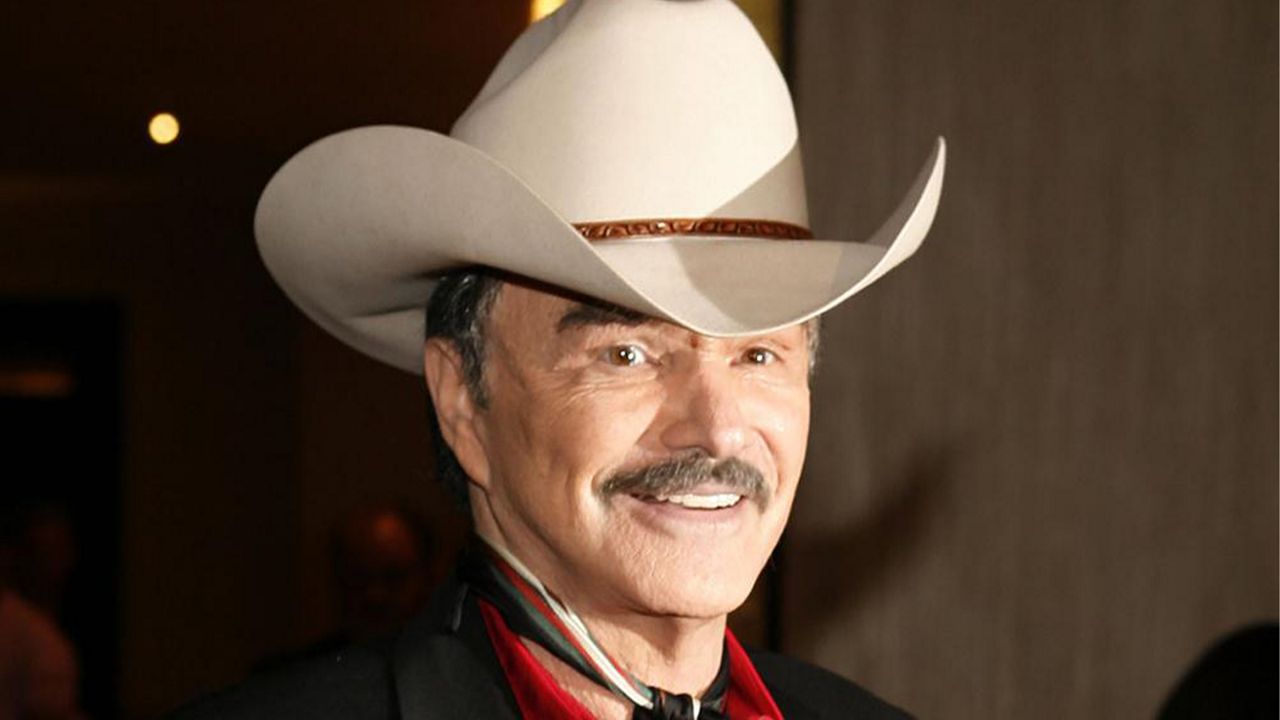 In the Aug. 12, 2006, file photo, actor Burt Reynolds poses for photographers at the Golden Boot Awards in Beverly Hills, Calif. (AP Photo/Matt Sayles, File)