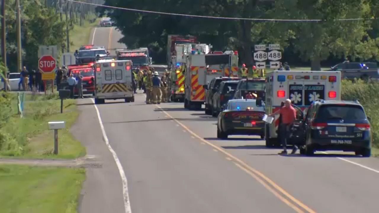 1 dead, 5 injured after medical transport bus is stuck by dump truck