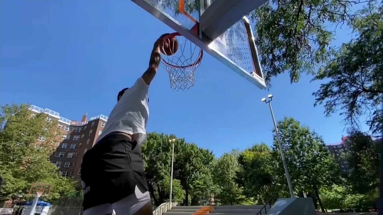 NYPD, community leaders unveil renovated Frederick Douglass Houses basketball  court