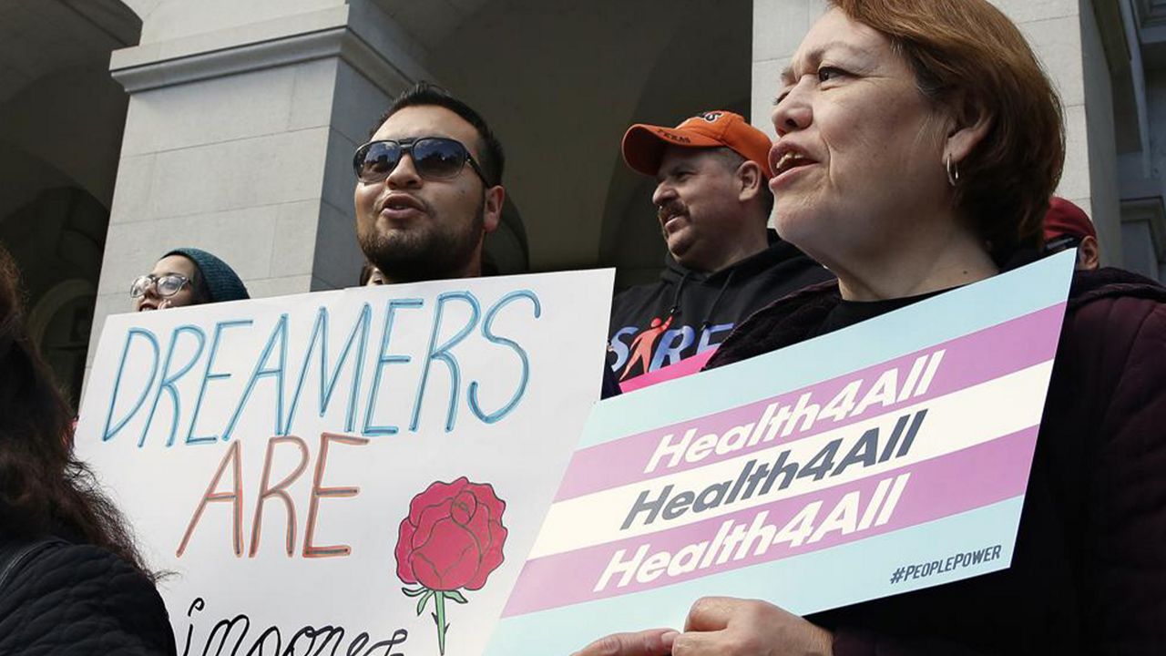 In this May 20, 2019, file photo, supporters of proposals to expand California's government-funded health care benefits to immigrants living in the country illegally, gathered at the Capitol for the Immigrants Day of Action, in Sacramento, Calif. (AP Photo/Rich Pedroncelli, File)