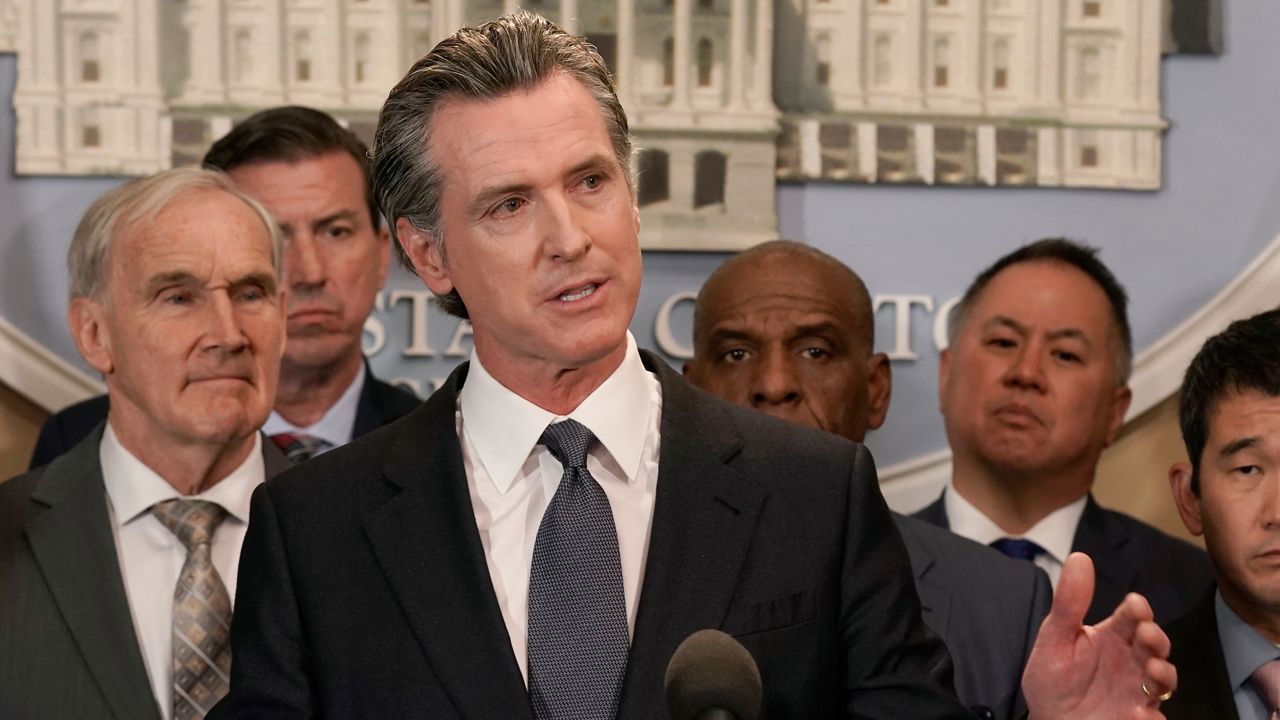 California Gov. Gavin Newsom discusses the recent mass shooting in Texas, during a news conference in Sacramento, Calif., Wednesday, May 25, 2022. Newsom signed a bill by Assemblyman Phil Ting, D-San Francisco, second from right, Tuesday, June 12, 2022, that creates a good conduct code for gun makers and dealers, and allows anyone who suffers harm from violations to sue. (AP Photo/Rich Pedroncelli File)