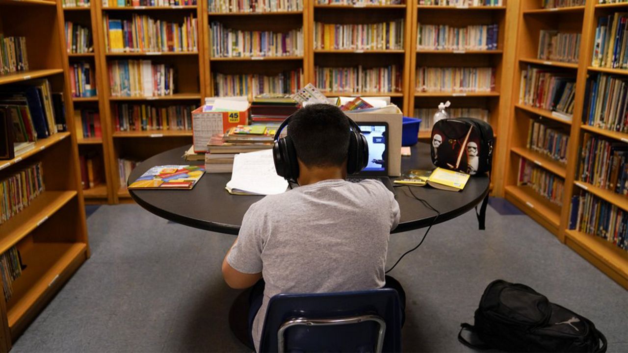 In this Aug. 26, 2020, file photo, a Los Angeles Unified School District student attends an online class at the Boys & Girls Club of Hollywood in Los Angeles. (AP Photo/Jae C. Hong, File)