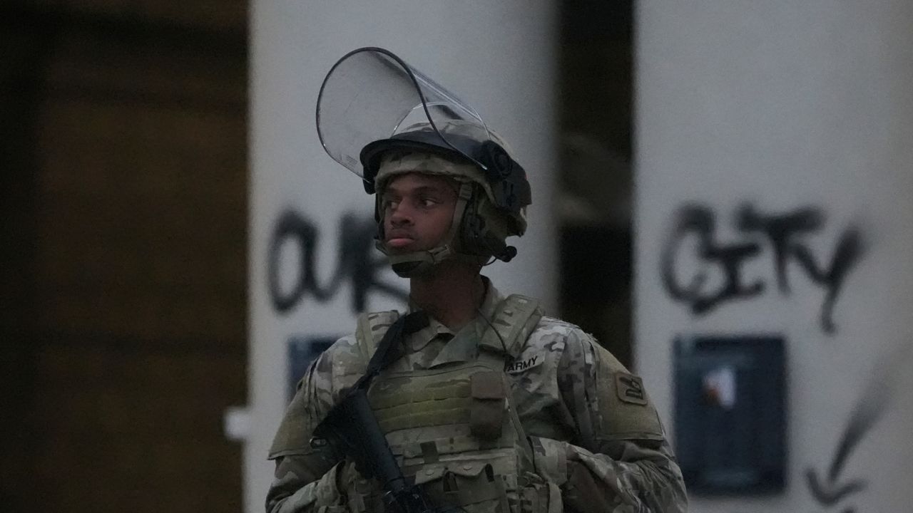 California National Guards guard Federal Building in downtown Los Angeles on Tuesday. (AP Photo Damian Dovarganes)