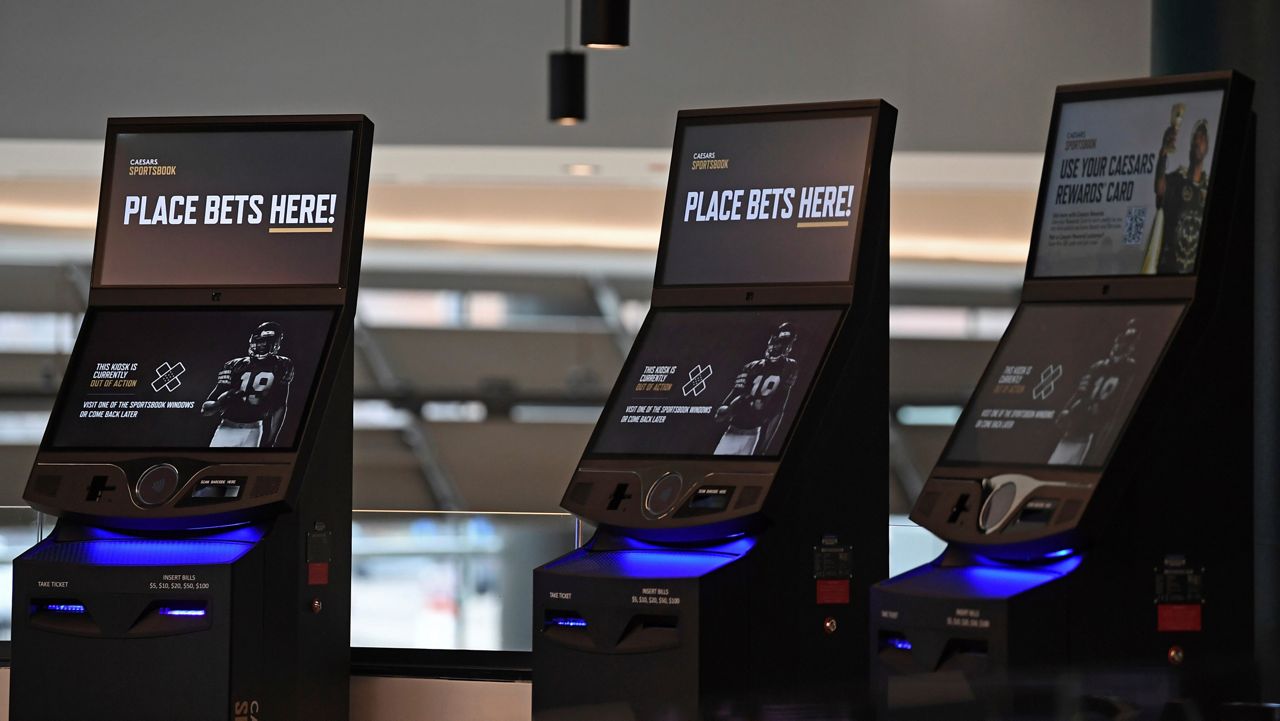 Betting kiosks are seen inside Caesars Sportsbook inside Rocket Mortgage FieldHouse, Thursday, Dec. 29, 2022, in Cleveland. (AP Photo/David Dermer)