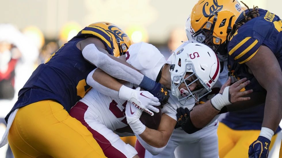 Stanford running back Mitch Leigber, middle, runs the ball against California during the first half of an NCAA college football game in Berkeley, Calif., Saturday, Nov. 19, 2022. Atlantic Coast Conference presidents and chancellors held a conference call Tuesday, Aug. 8, 2023, but took no action on West Coast expansion with California and Stanford, a person with knowledge of the situation told The Associated Press. (AP Photo/Godofredo A. Vásquez, File)