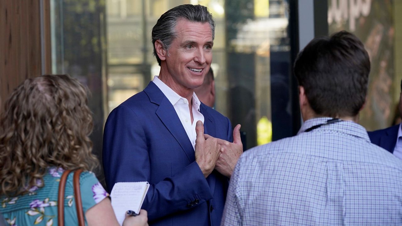 California Gov. Gavin Newsom speaks with reporters said on Friday, Oct. 7, 2022, in Sacramento. (AP Photo/Rich Pedroncelli)