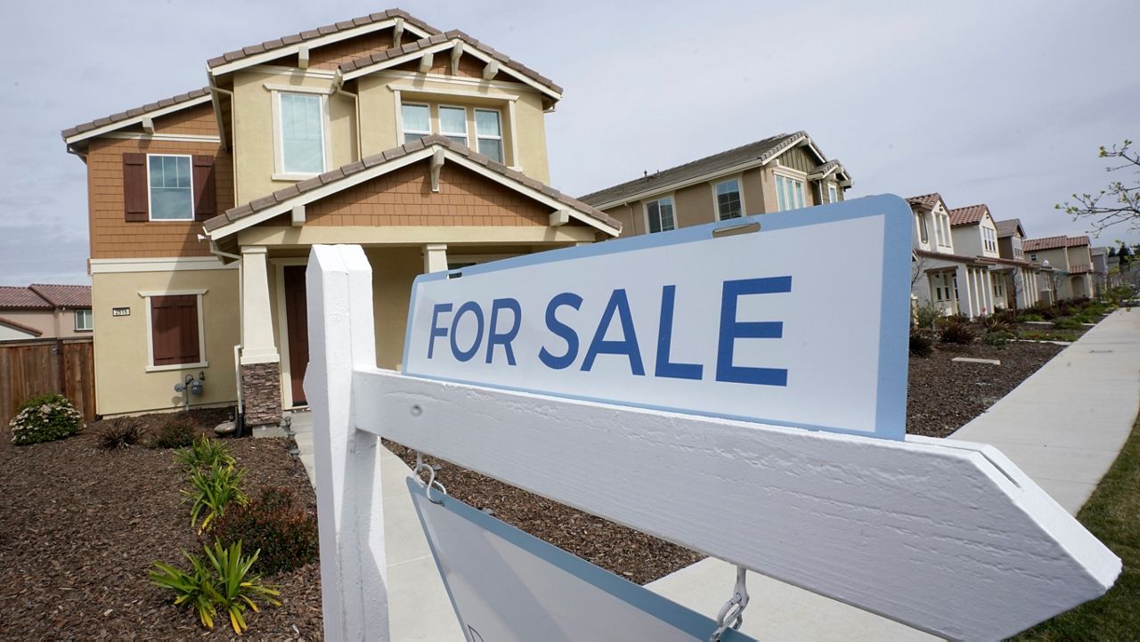 A for sale sign is posted in front of a home in Sacramento, Calif., Thursday, March 3, 2022. (AP Photo/Rich Pedroncelli, File)