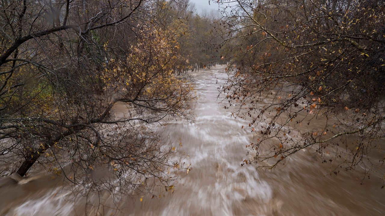 The Carmel River flows heavily after recent rains in Carmel Valley, Calif., Monday, Jan. 9, 2023. (AP Photo/Nic Coury, File)