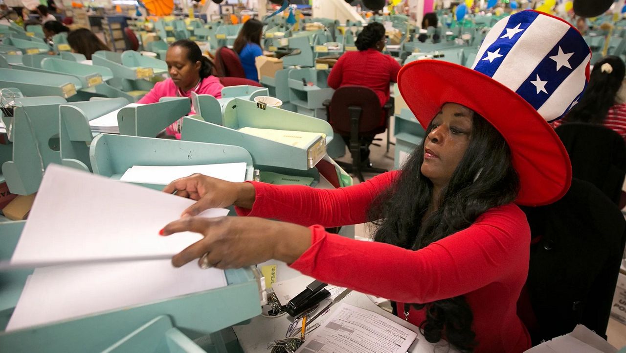 Workers sort California income tax returns at the Franchise Tax Board office in Sacramento on April 18, 2017. (AP Photo/Rich Pedroncelli)