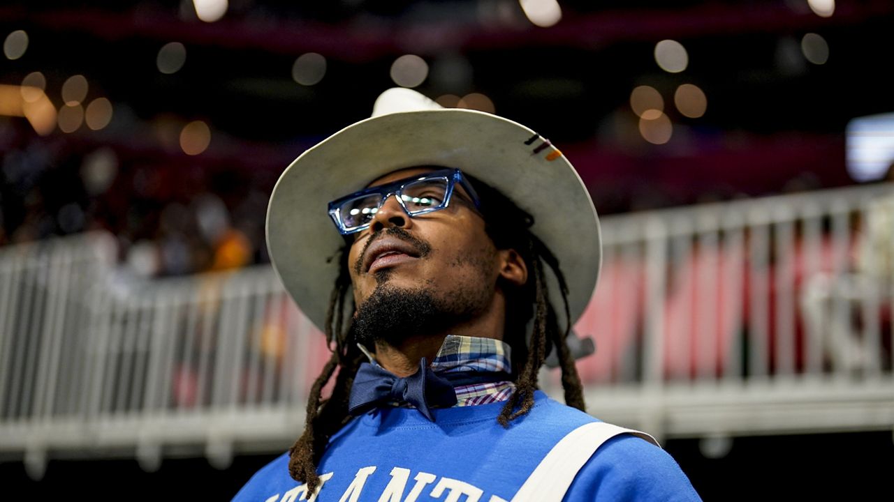 NFL football player Cam Newton watches play between Howard and Florida A&M during the first half of an NCAA Celebration Bowl football game, Dec. 16, 2023, in Atlanta. A video surfaced Sunday, Feb. 25, 2024, that appeared to show Newton being involved in a scuffle at a 7-on-7 youth football tournament in Atlanta. (AP Photo/Mike Stewart, File)