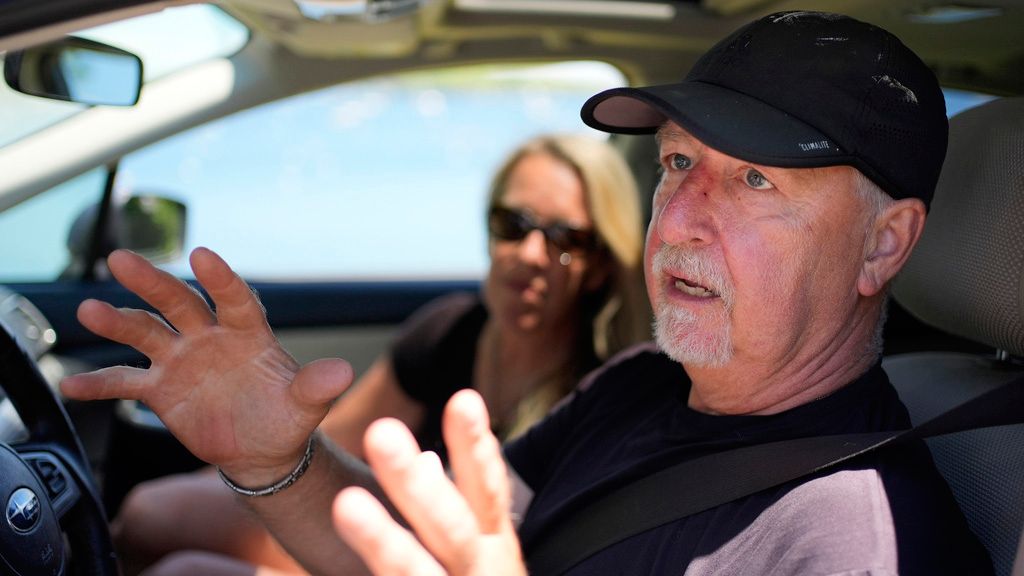Paul Hodgson talks about the anger in the community over one homeowner's poisoning of a neighbor's trees to gain a waterfront view, Tuesday, June 4, in Camden. (AP Photo/Robert F. Bukaty)