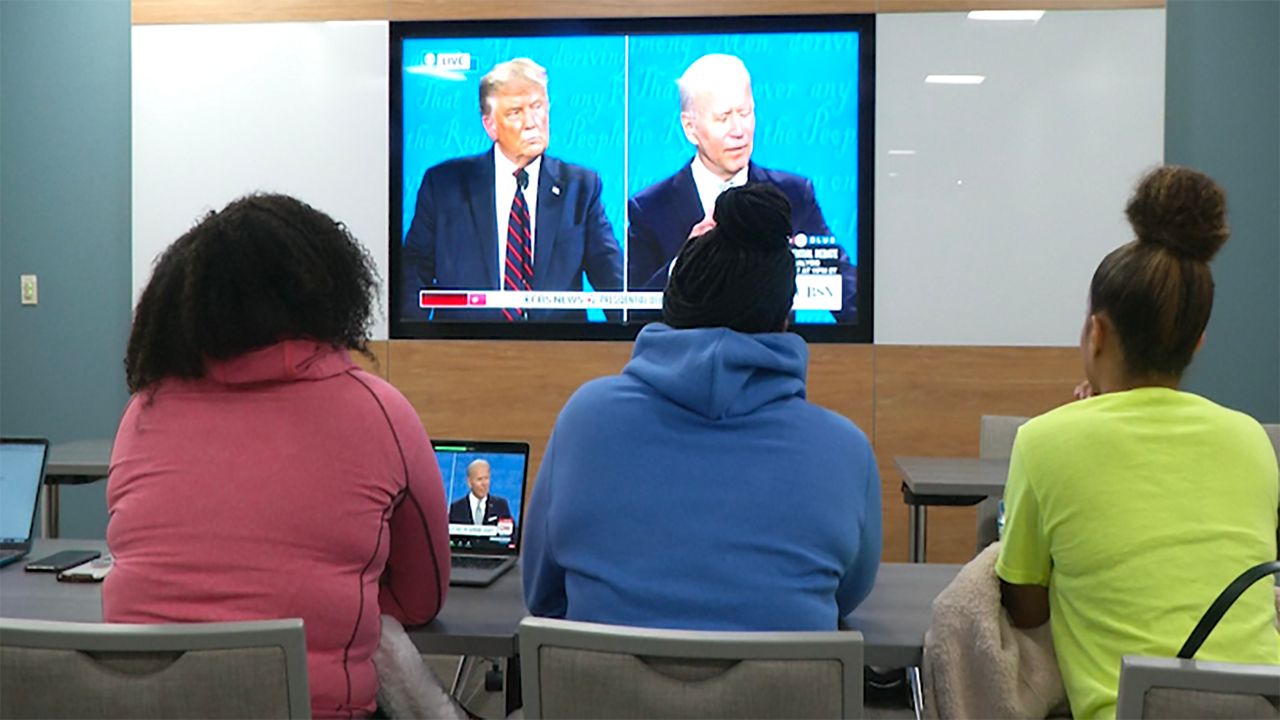 Photo of students watching the debate through a virtual watch party. 