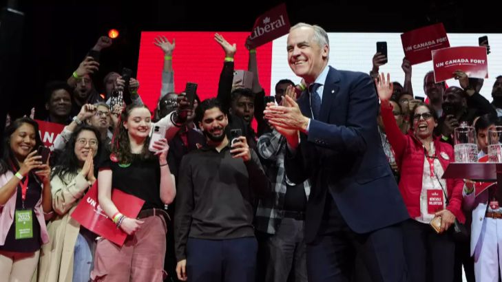 Canadian Prime Minister Mark Carney arrives onstage Tuesday at his campaign headquarters after the Liberal Party won the Canadian election in Ottawa. (Associated Press/Justin Tang)