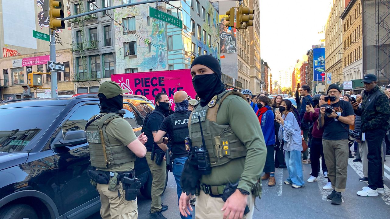 Federal agents detain immigrants on Canal Street