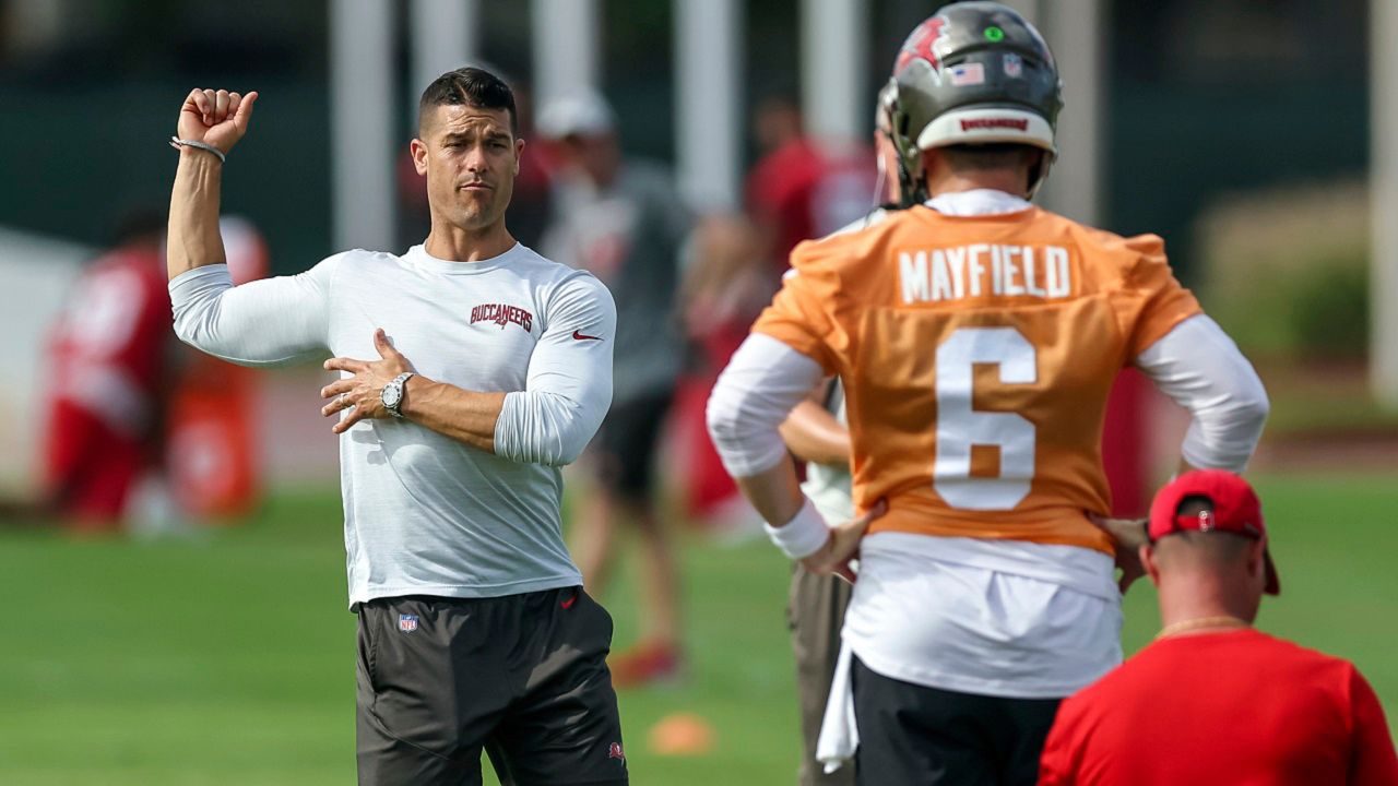 Tampa Bay Buccaneers offensive coordinator Dave Canales, left, talks with quarterback Baker Mayfield during practice Tuesday, June 13, 2023, in Tampa, Fla. (AP File Photo/Mike Carlson)