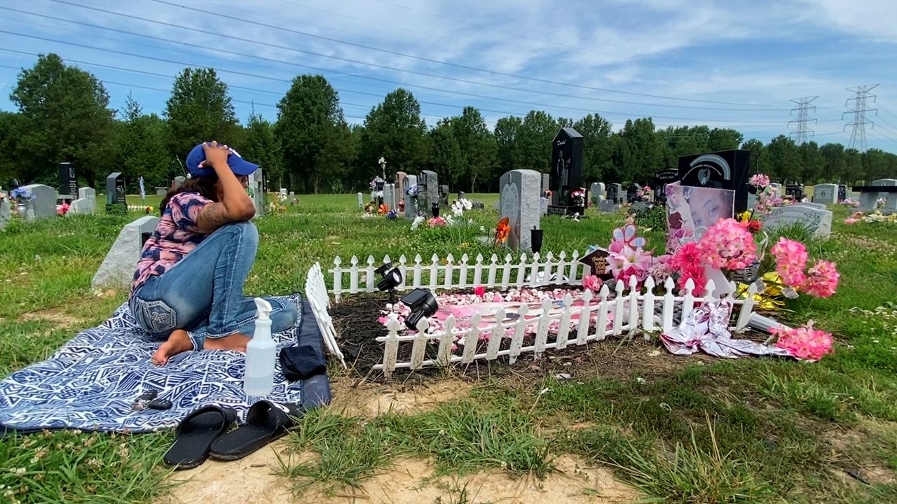 From a blanket in a cemetery, a Louisville mother mourns