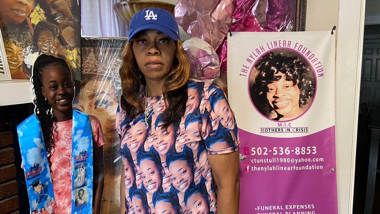 From a blanket in a cemetery, a Louisville mother mourns