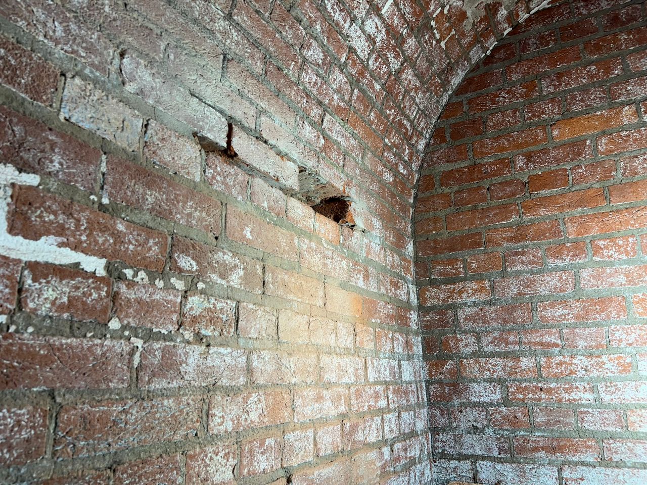 A photo from inside the lighthouse shows where bricks have been damaged and need to be replaced. (National Park Service)