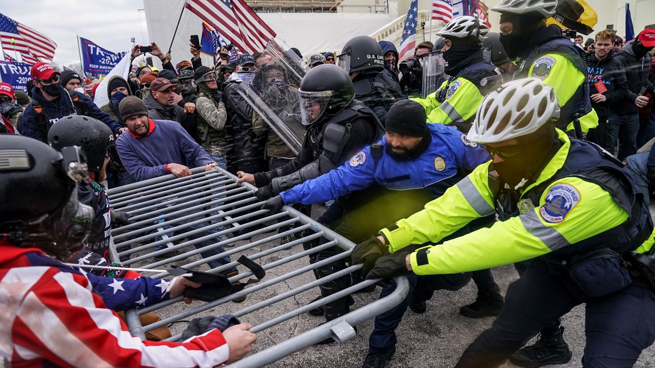 Insurrectionists loyal to President Donald Trump try to break through a police barrier, Wednesday, Jan. 6, 2021, at the Capitol in Washington. (AP File Photo)