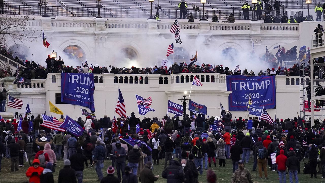 Violent protesters loyal to then-President Donald Trump storm the U.S. Capitol on Jan. 6. (AP Photo/John Minchillo, File)