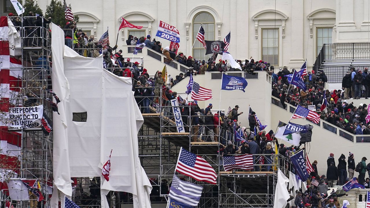 Rioters loyal to President Donald Trump storm the U.S. Capitol on Jan. 6. (AP Photo/John Minchillo, File)