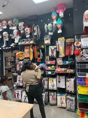 A shopper and her child look at costumes, wigs and accessories inside Cappel's. (Spectrum News/Casey Weldon)