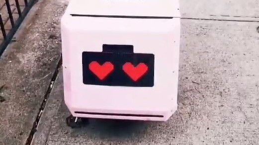 Pink robots with heart eyes will be delivering lattes and other coffee shop treats to residents in Charlotte's Plaza Midwood area (Credit: Tiny Mile via TikTok)