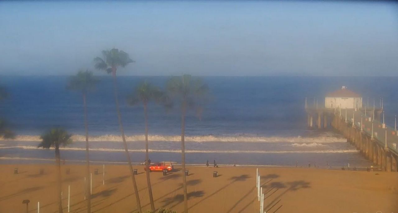 Sunny Wednesday and Breezy with cool to mild temperatures. Manhattan Pier image courtesy of Surfline.com