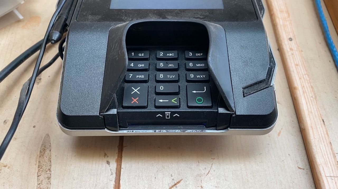 Credit card skimmers can be placed on a card reader to steal someone's card information. 