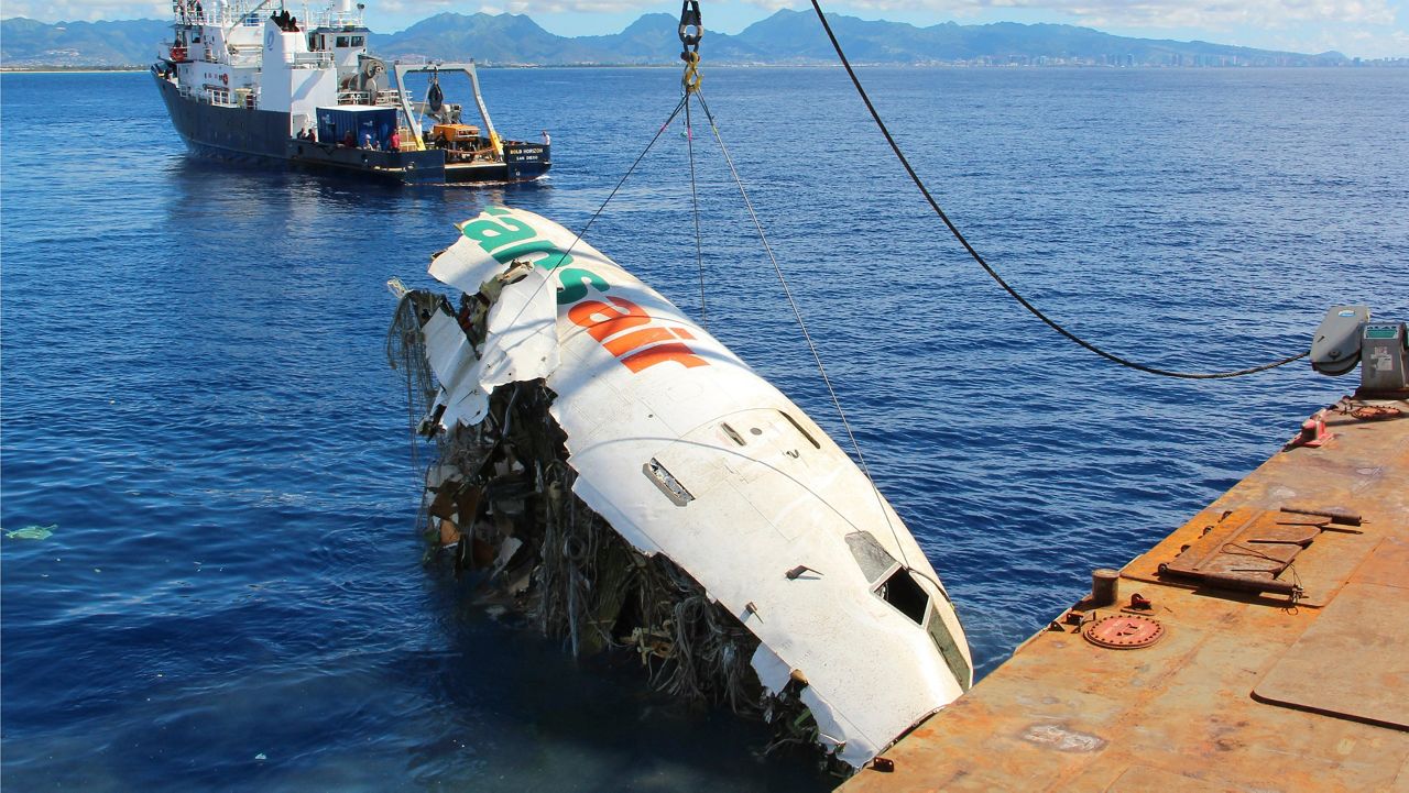 In this photo provided by the National Transportation Safety Board, the forward section of the fuselage of Transair flight 810 is recovered from the Pacific Ocean near Honolulu on Oct. 20, 2021. (Clint Crookshanks/National Transportation Safety Board via AP, File)