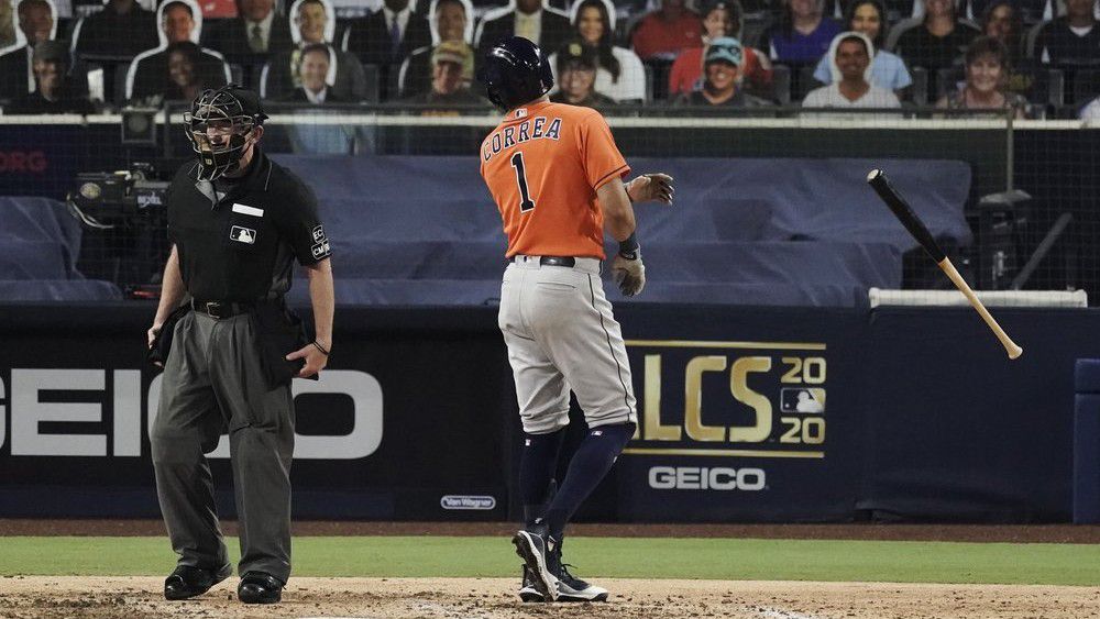 Houston Astros Carlos Correa tosses his bat and has words with home plate umpire Lance Barksdale after striking out during the fourth inning in Game 7 of a baseball American League Championship Series, Saturday, Oct. 17, 2020, in San Diego. (AP Photo/Jae C. Hong)