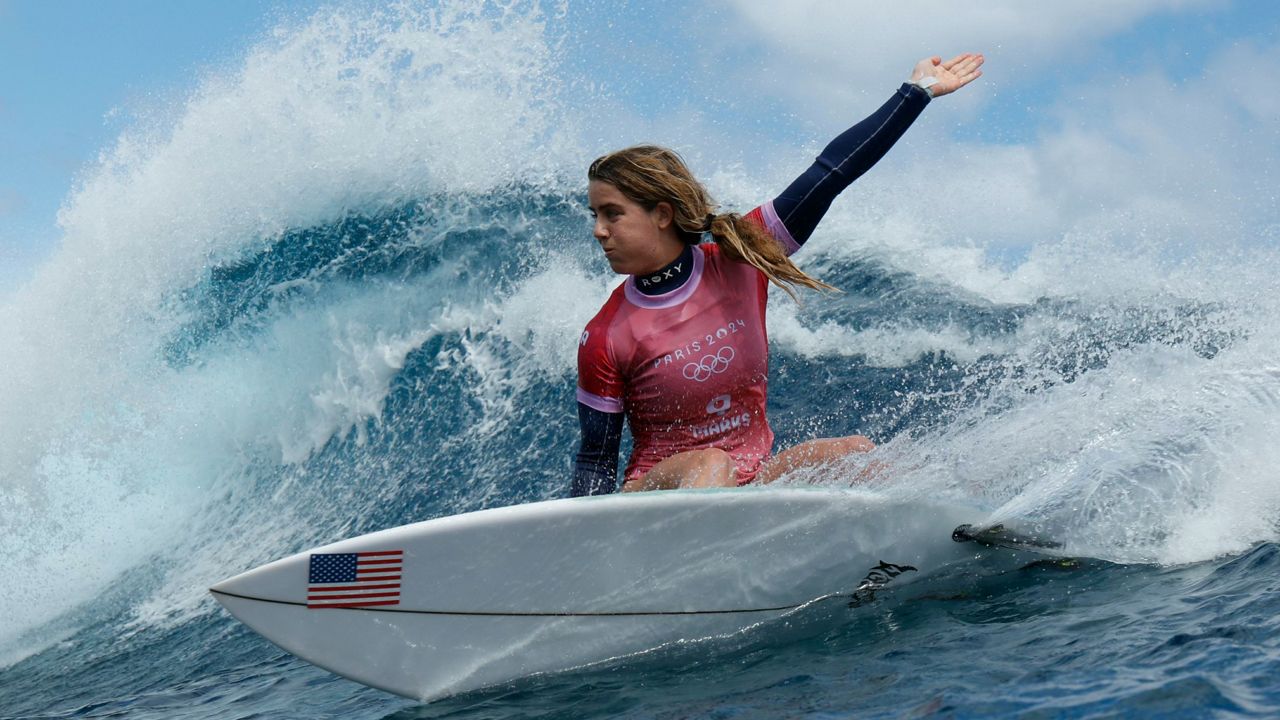 Melbourne Beach native Caroline Marks turns on a wave in the semifinals of the surfing competition at the 2024 Summer Olympics, Monday, Aug. 5, 2024, in Teahupo'o, Tahiti. (Ben Thouard/Pool Photo via AP)