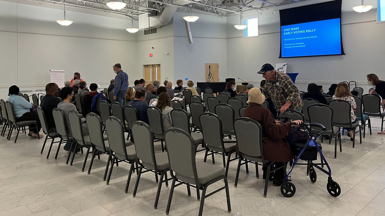 Voters listen to candidates Thursday at Cary Town Hall before heading to the polls. (Photo: Amanda Rose).