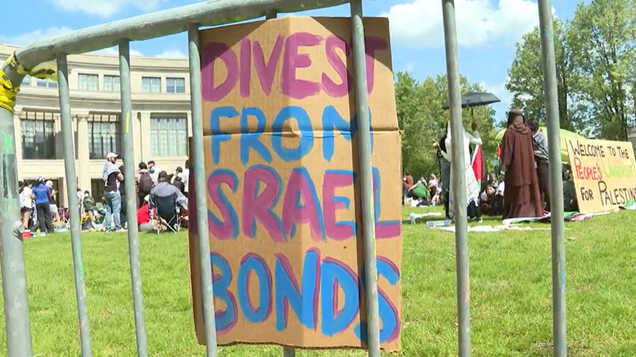 Students gather at Case Western Reserve University in Cleveland, Ohio. A sign calling for divestment from Israel bonds is put up.