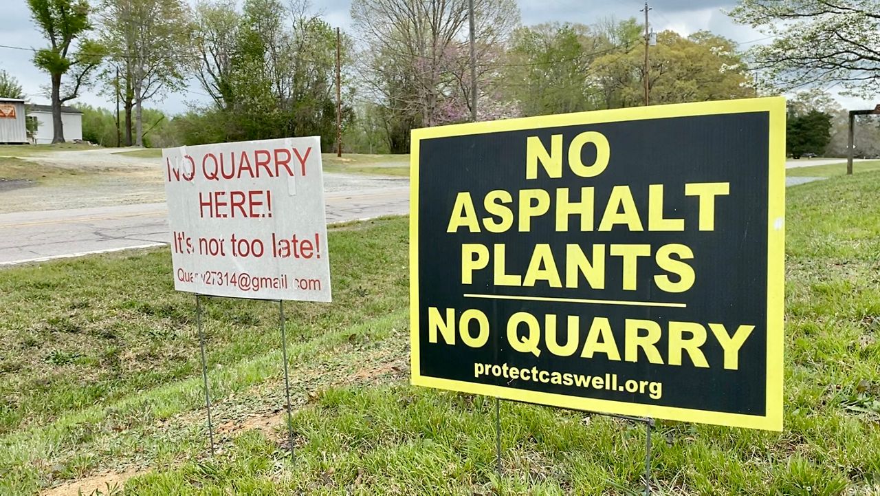 Signs protesting the potential asphalt plant in Caswell County (Chris O'Brien/Spectrum News).